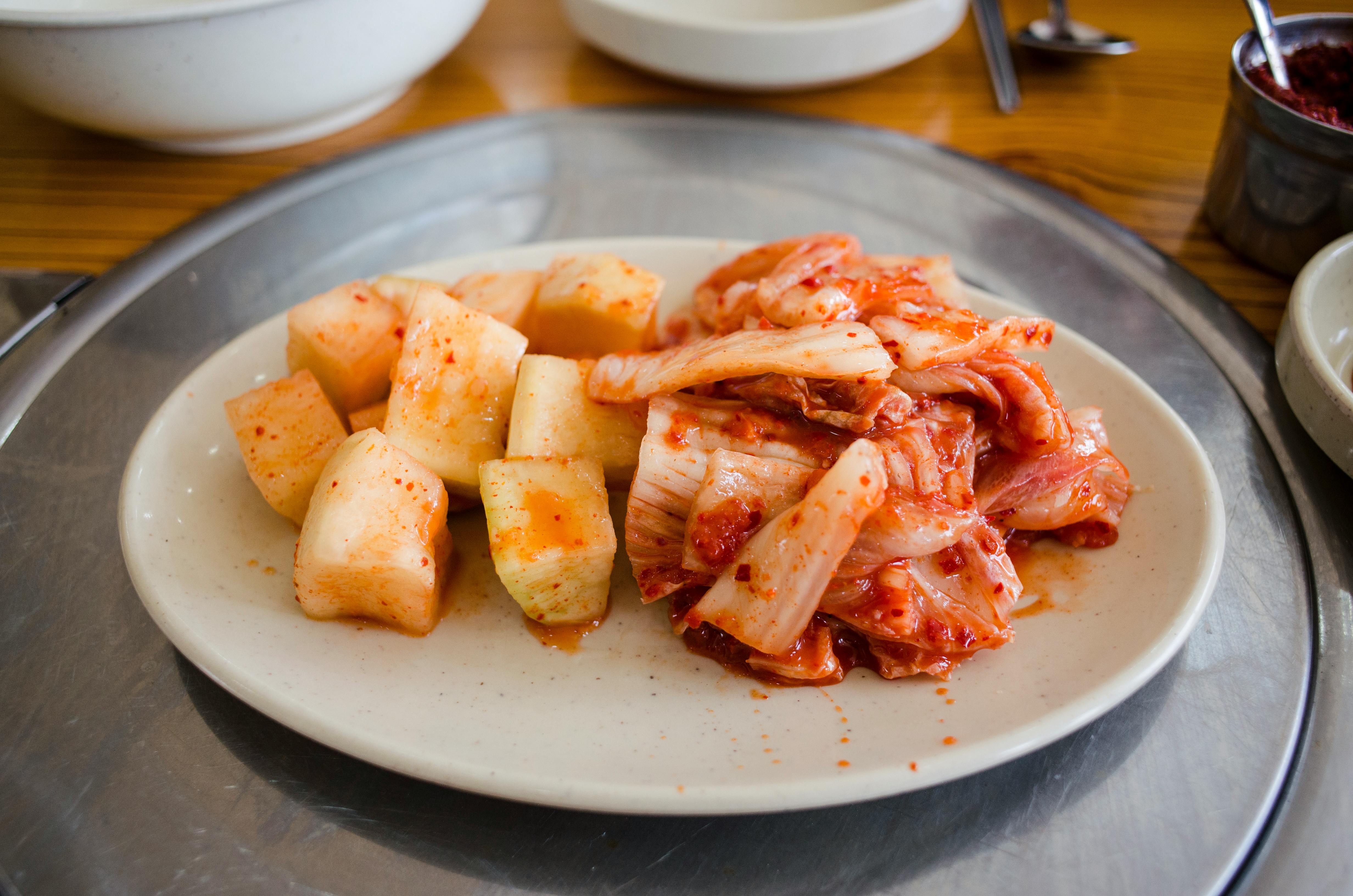 Traditional Korean Kimchi made from fermented napa cabbage seasoned with red chili powder, garlic, and ginger